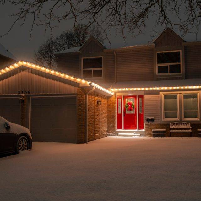 Nighttime,Shot,Of,A,Detached,Suburban,House,With,A,Red